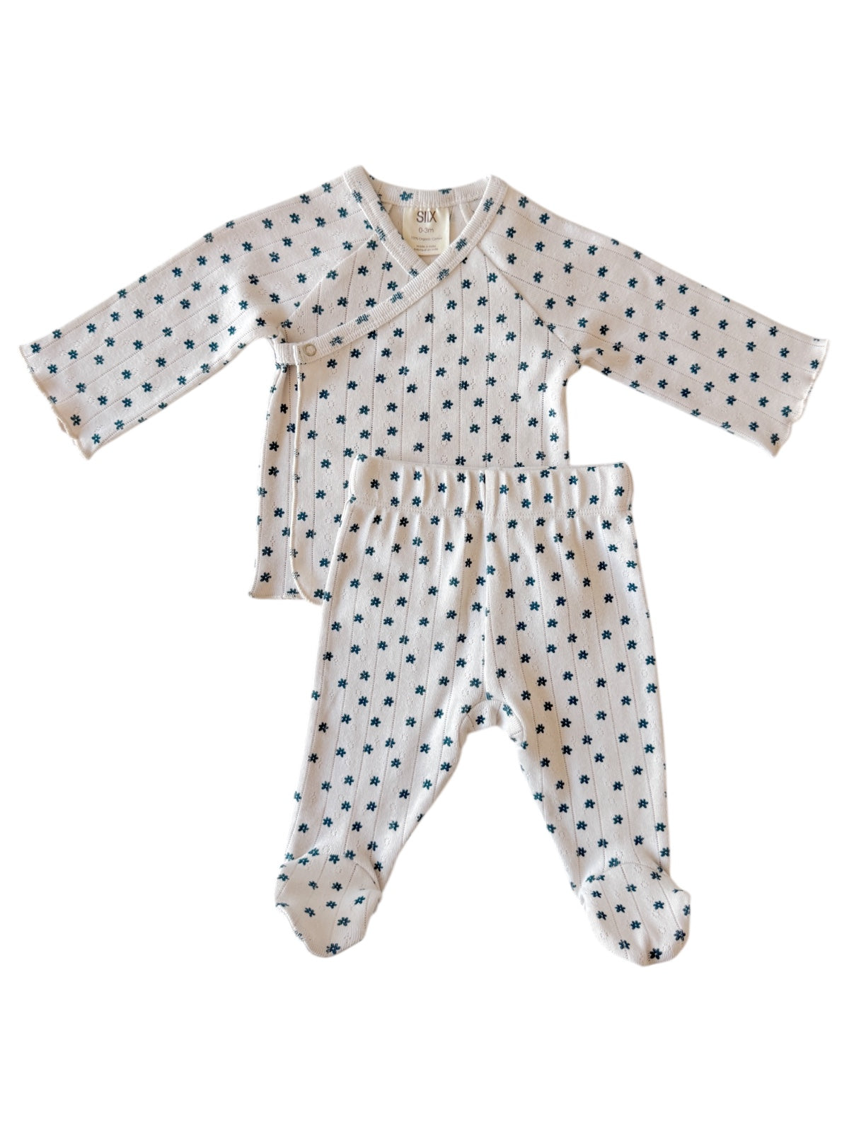 Baby outfit with long-sleeve top and footed pants, featuring a floral print on a light background.