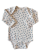 Long-sleeve baby onesie with a floral pattern on a light background. Suitable for toddlers.