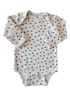 Long-sleeve baby onesie with a floral pattern on a light background. Suitable for toddlers.
