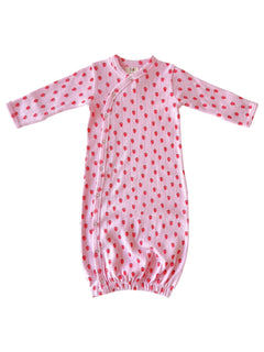 Pink baby gown with red strawberry patterns and elasticized bottom for comfort.