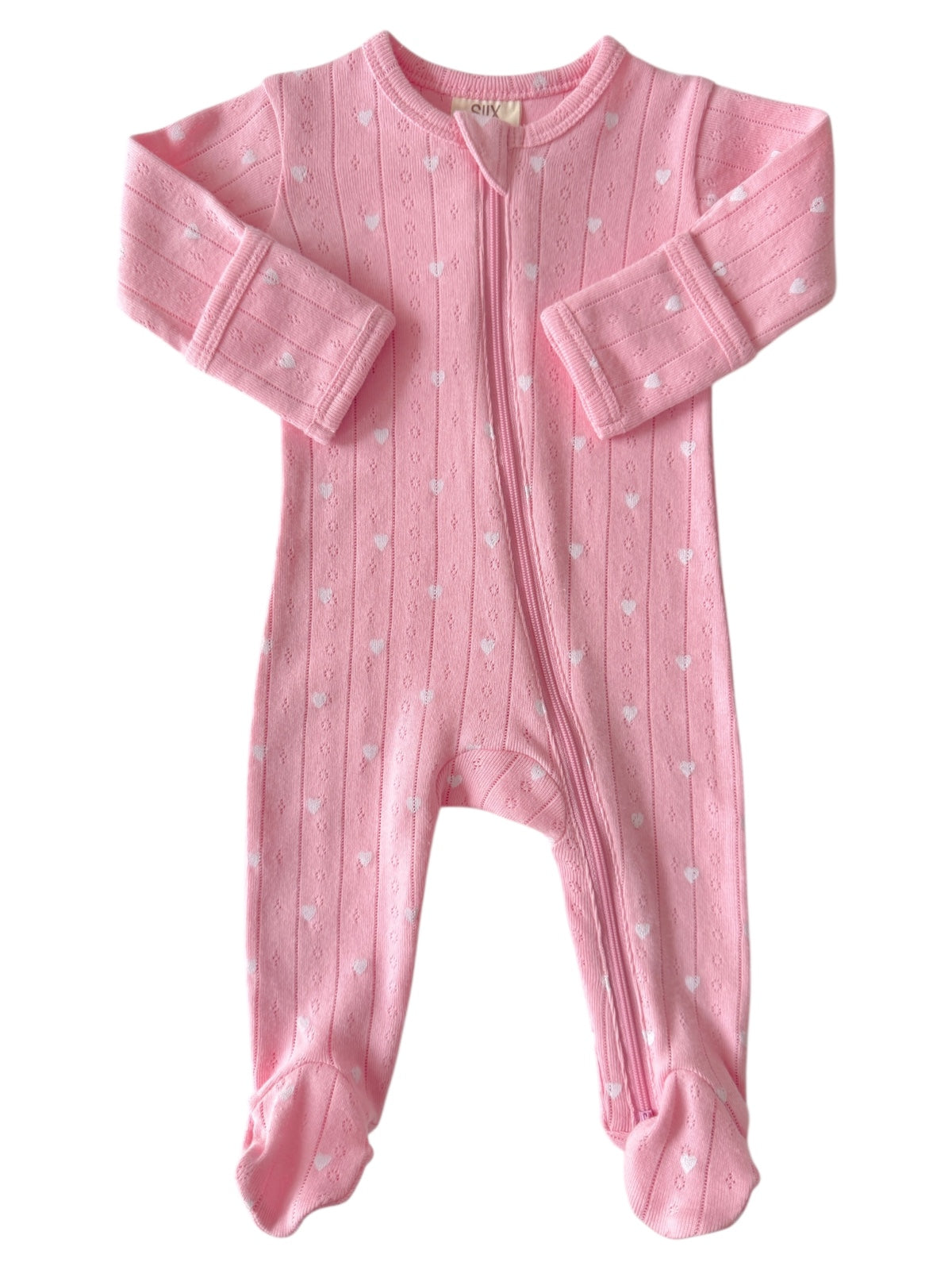 Pink infant onesie with white heart patterns and long sleeves, featuring a front zipper for easy dressing.