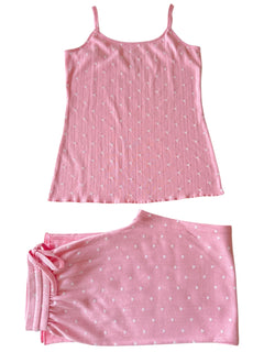 Pink sleep set featuring a sleeveless top and matching shorts with heart patterns. Ideal for comfortable lounging.