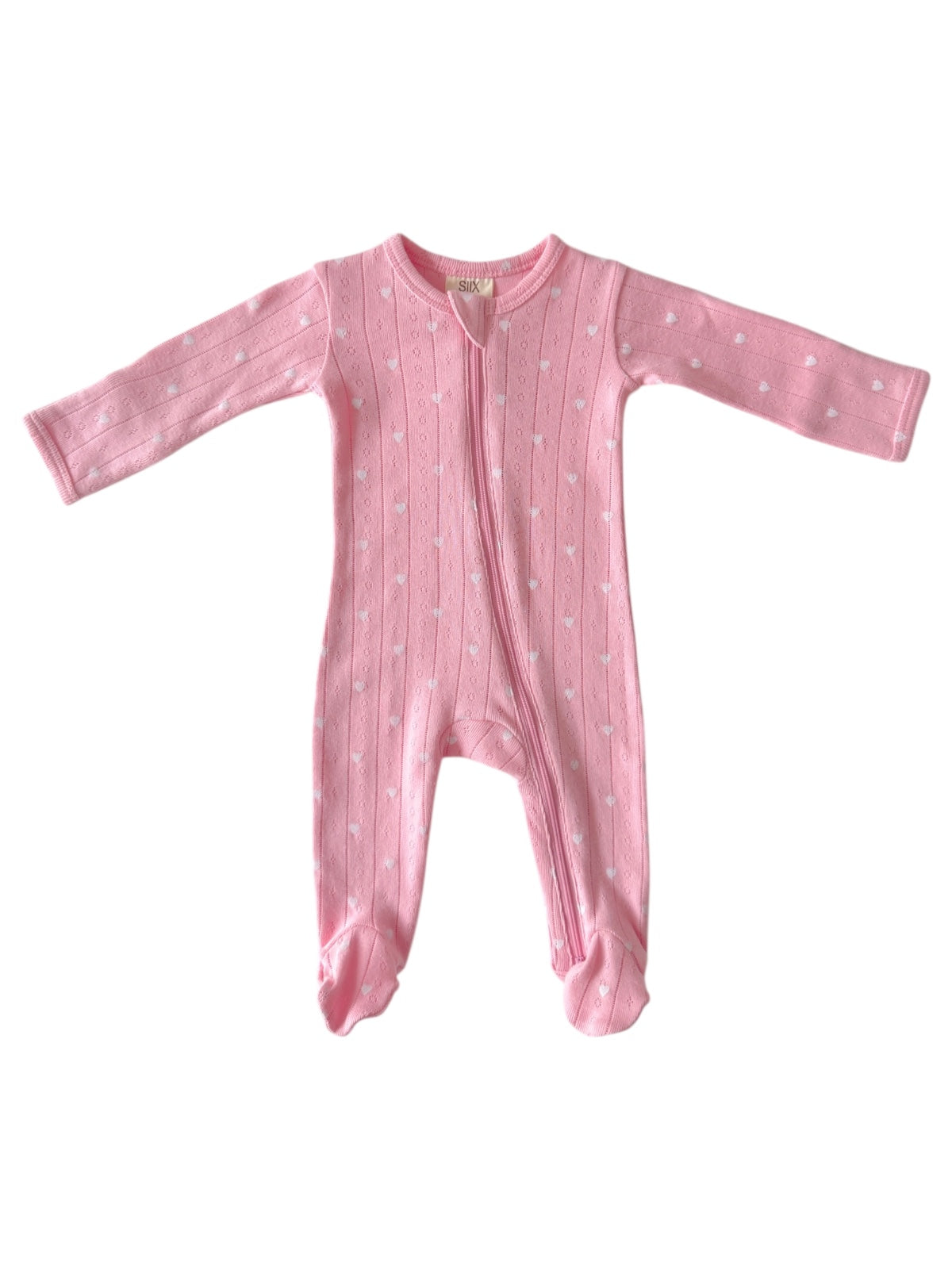 Pink toddler onesie with long sleeves and footed design, featuring a subtle heart pattern and front zipper.