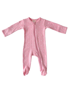 Pink toddler onesie with long sleeves and footed design, featuring a subtle heart pattern and front zipper.