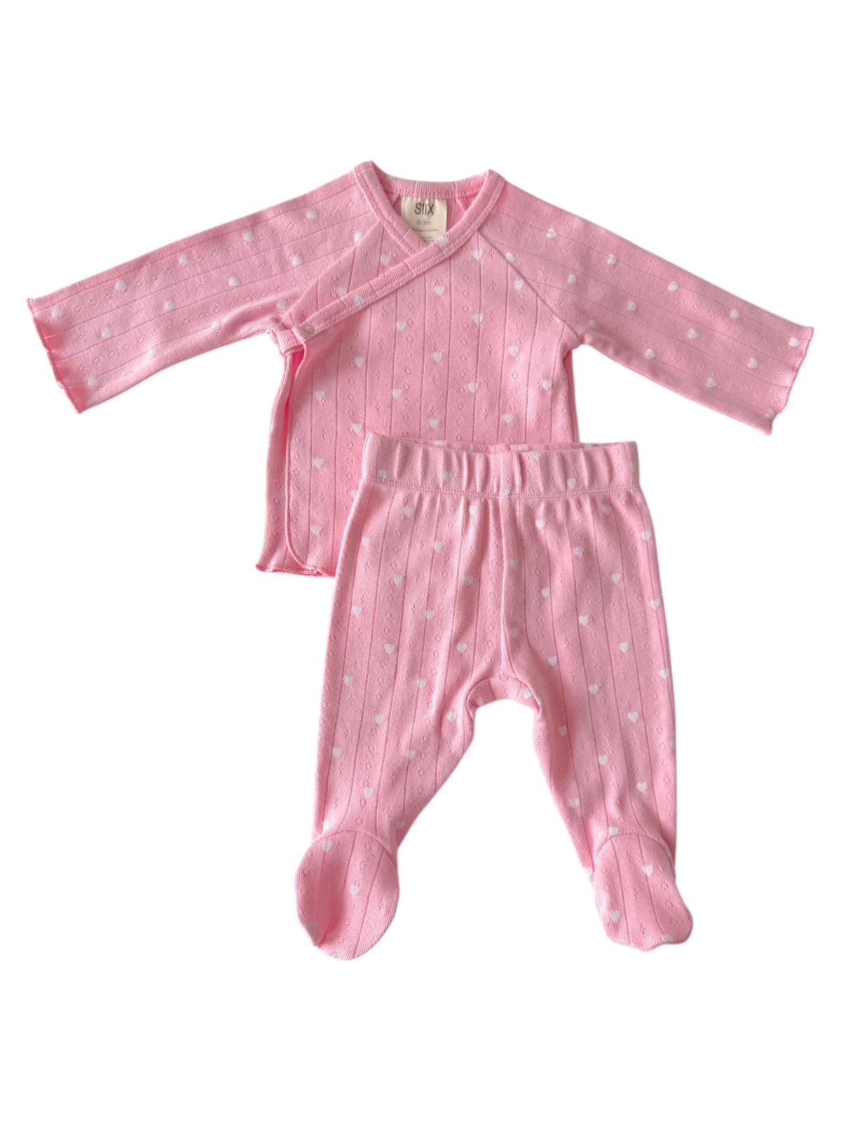 Pink baby outfit featuring a long-sleeve wrap top and matching pants with heart patterns.