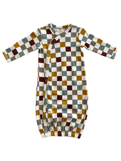 Colorful checkered baby gown with long sleeves and snap buttons, featuring shades of green, brown, yellow, and white.