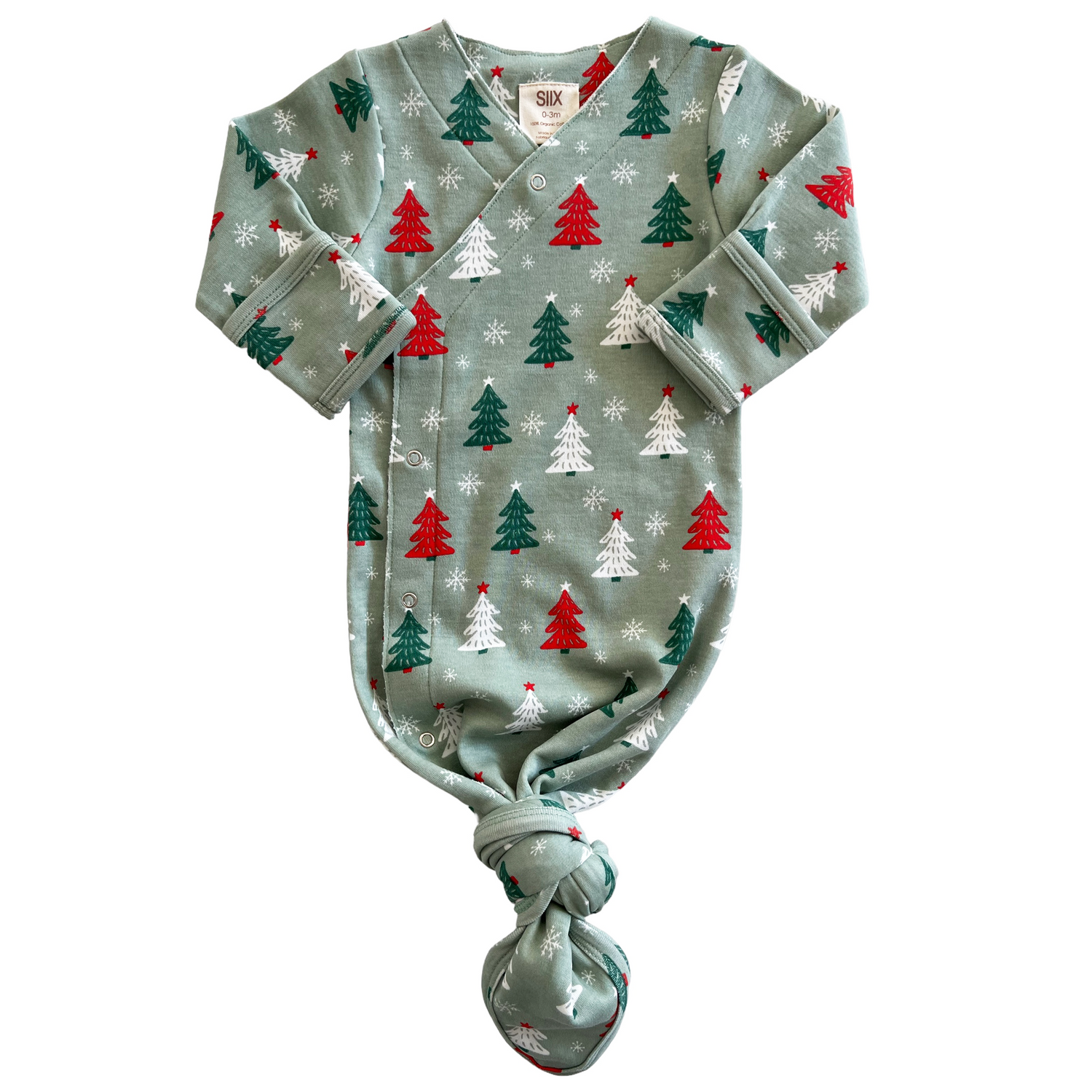 Festive baby onesie with red and green Christmas trees and snowflakes on a mint green background.