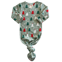 Festive baby onesie with red and green Christmas trees and snowflakes on a mint green background.