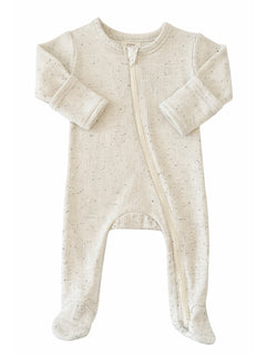 Beige baby onesie with a front zipper and footed design, featuring a textured ribbed pattern.