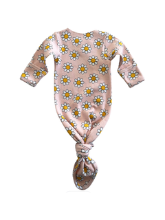 Pink floral baby onesie with yellow daisies, tied at the bottom for easy dressing.