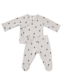 Light gray baby outfit with black lightning bolt prints, including a wrap top and footed pants.