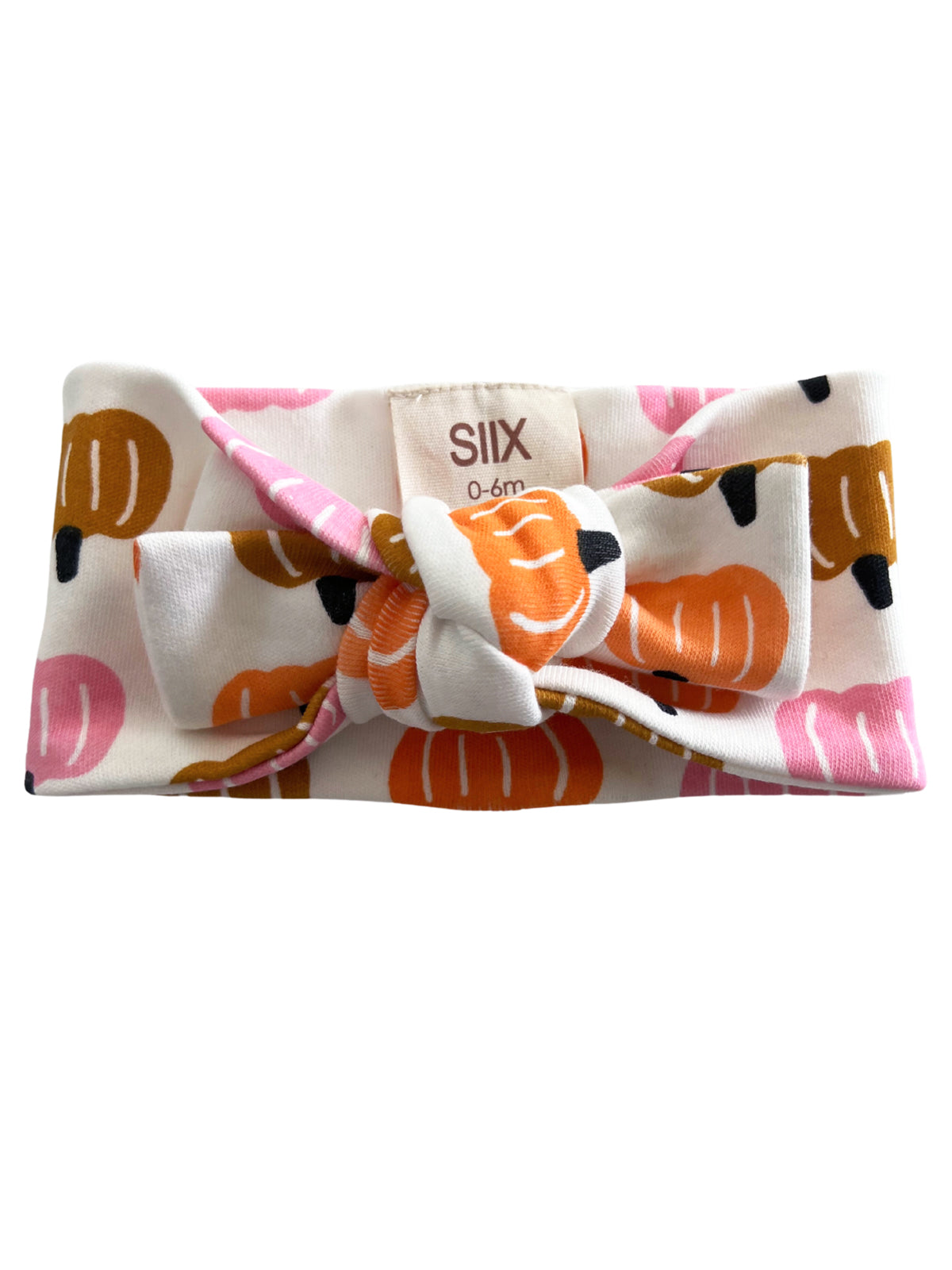 Baby headband with pumpkin patterns in pink, orange, and brown on a white background, size 0-6 months.