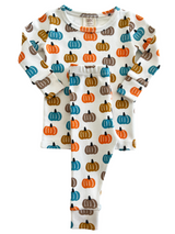 Colorful toddler pajama set featuring pumpkin patterns on a white background. Ideal for fall festivities.