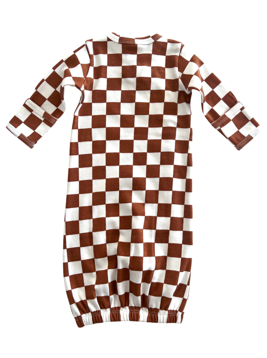 Brown and white checkered dress with long sleeves and gathered hem.