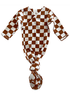 Brown and white checkered baby knotted gown with long sleeves and snap closures.