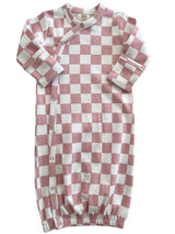 Pink and white checked baby sleep sack with long sleeves and snap buttons. Soft cotton material for comfort.