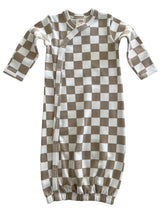 Brown and white checkered baby sleep sack with long sleeves and snap buttons. Soft, cozy, and designed for comfort.