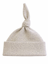 Light gray knotted baby hat with a soft, speckled texture and a folded cuff. Ideal for infants.